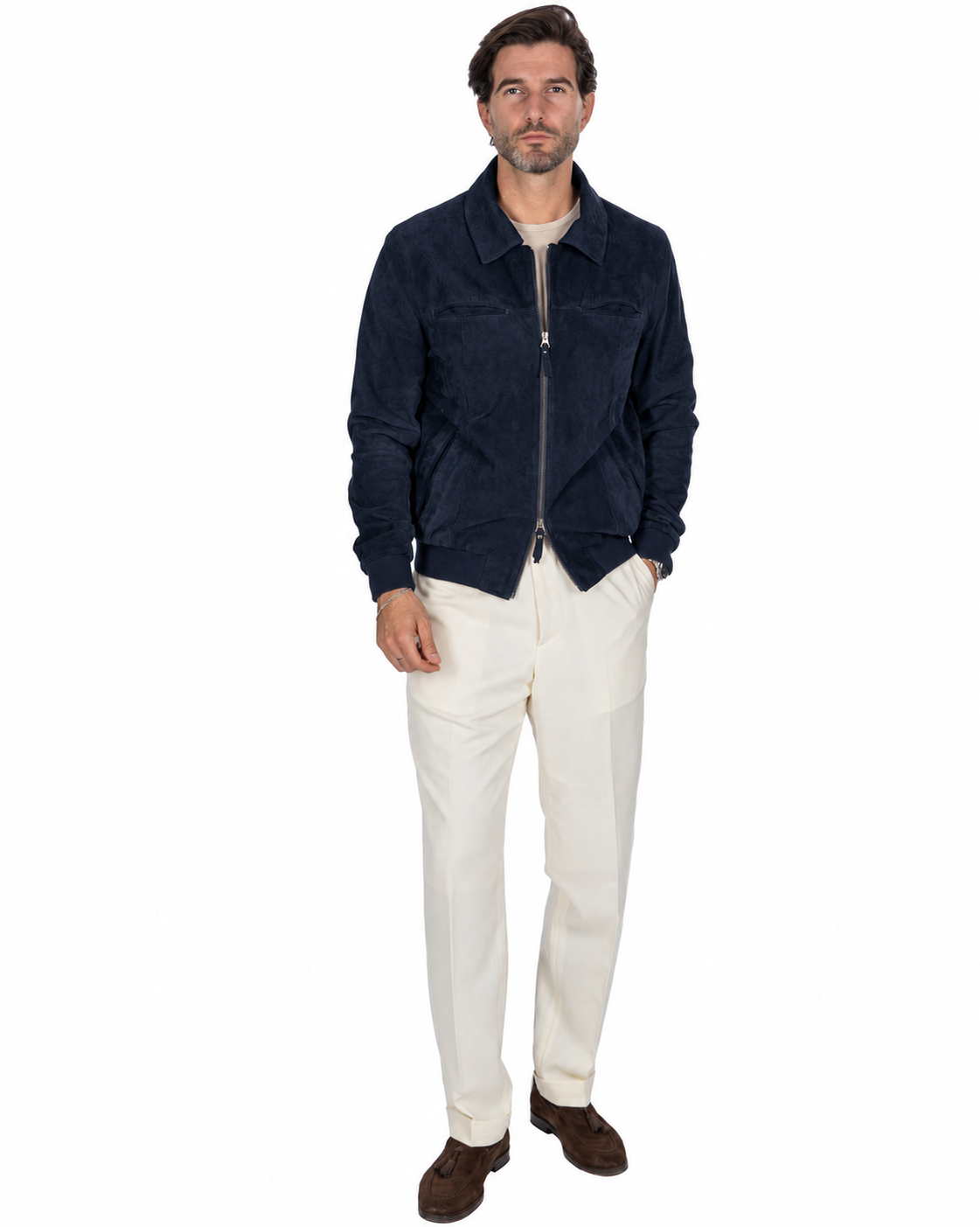 Navy suede jacket with zip closure, paired with cream trousers for a stylish, modern look.
