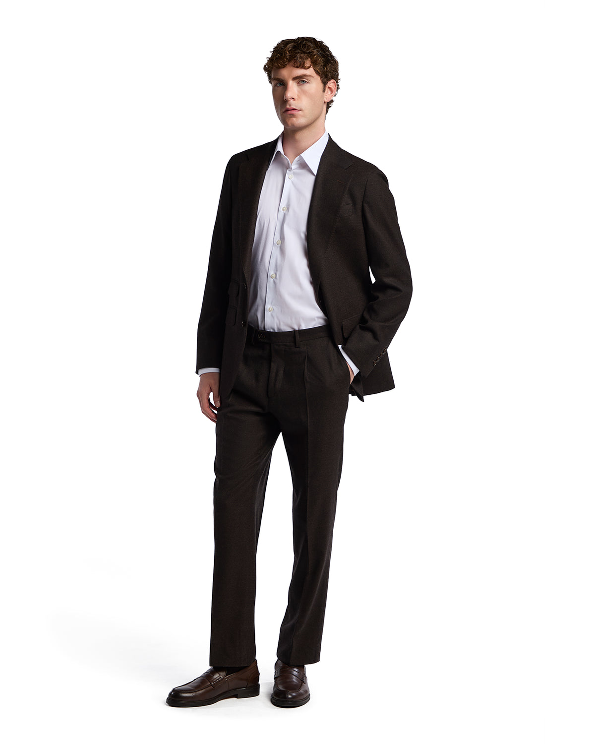Men's tailored dark brown suit with a light blue dress shirt, featuring a modern fit and elegant style.