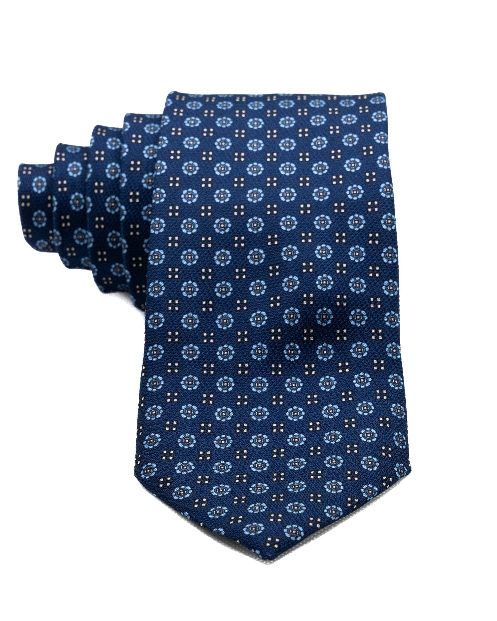 Tie - in blue silk with relief designs